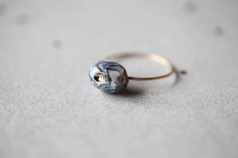 Laxá, porcelain ring, glazed and painted with gold